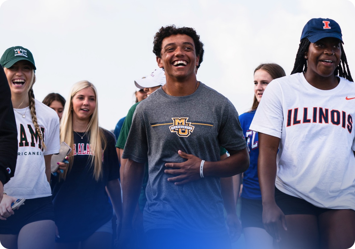 College athletes walking together wearing university gear