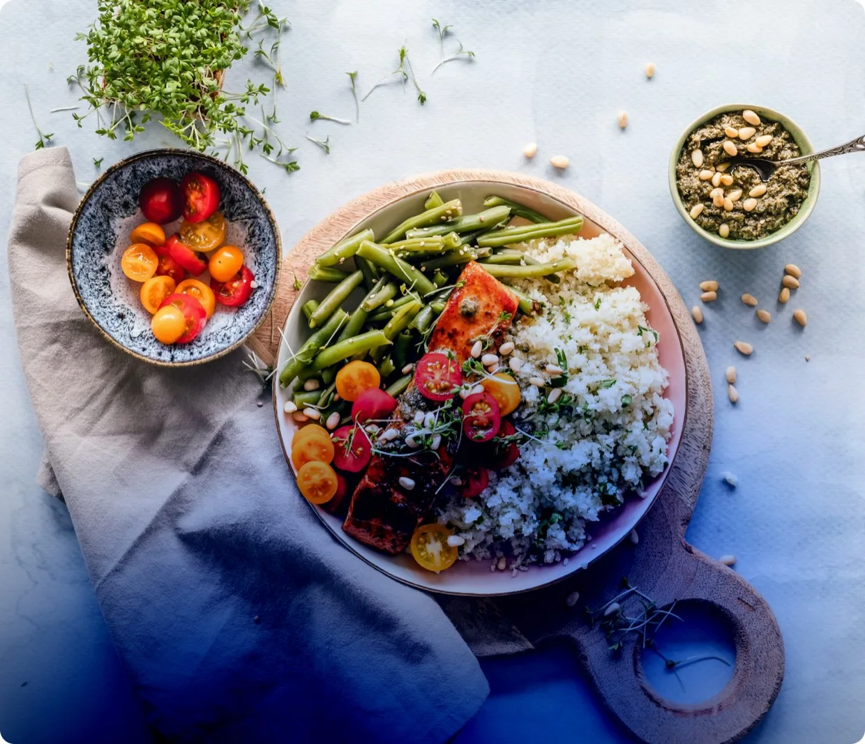 Salmon and vegetable bowl with pesto, styled for IMG Academy nutrition coaching