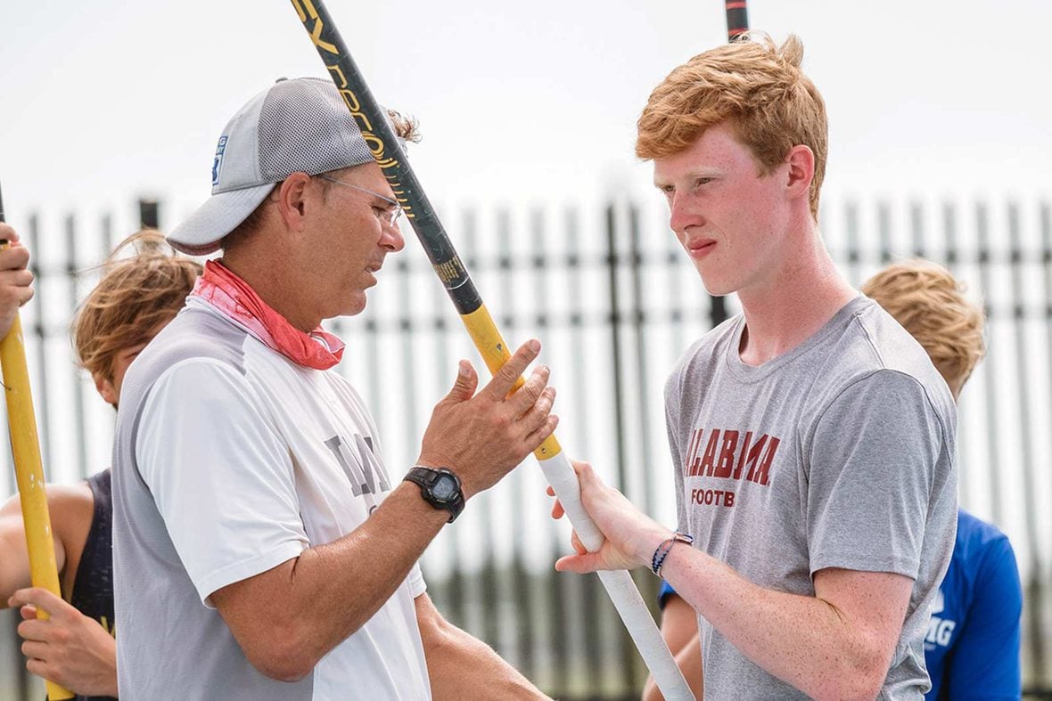 An IMG Academy coach giving one-on-one instruction to a camper