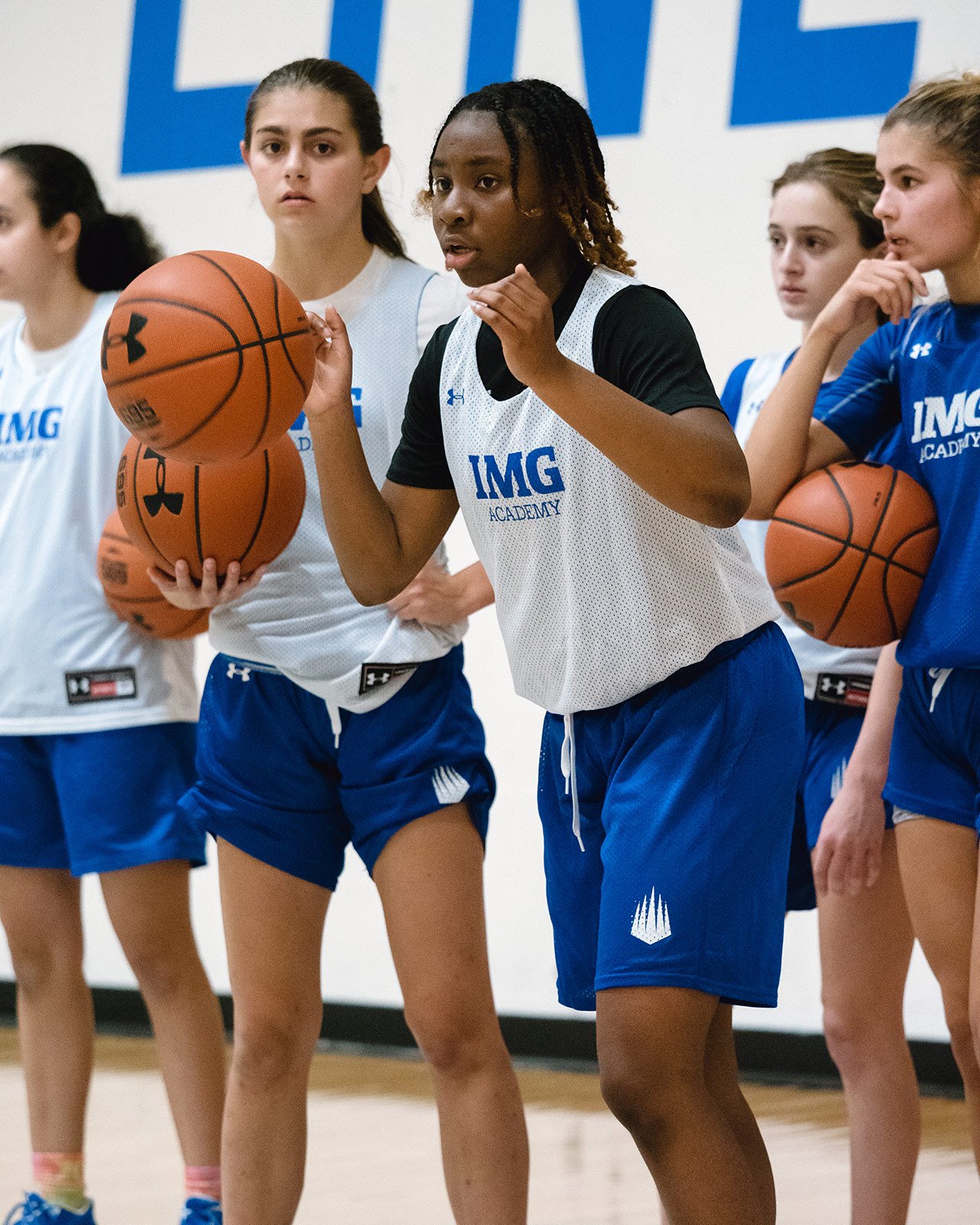IMG Academy girls basketball campers practice basketball drills
