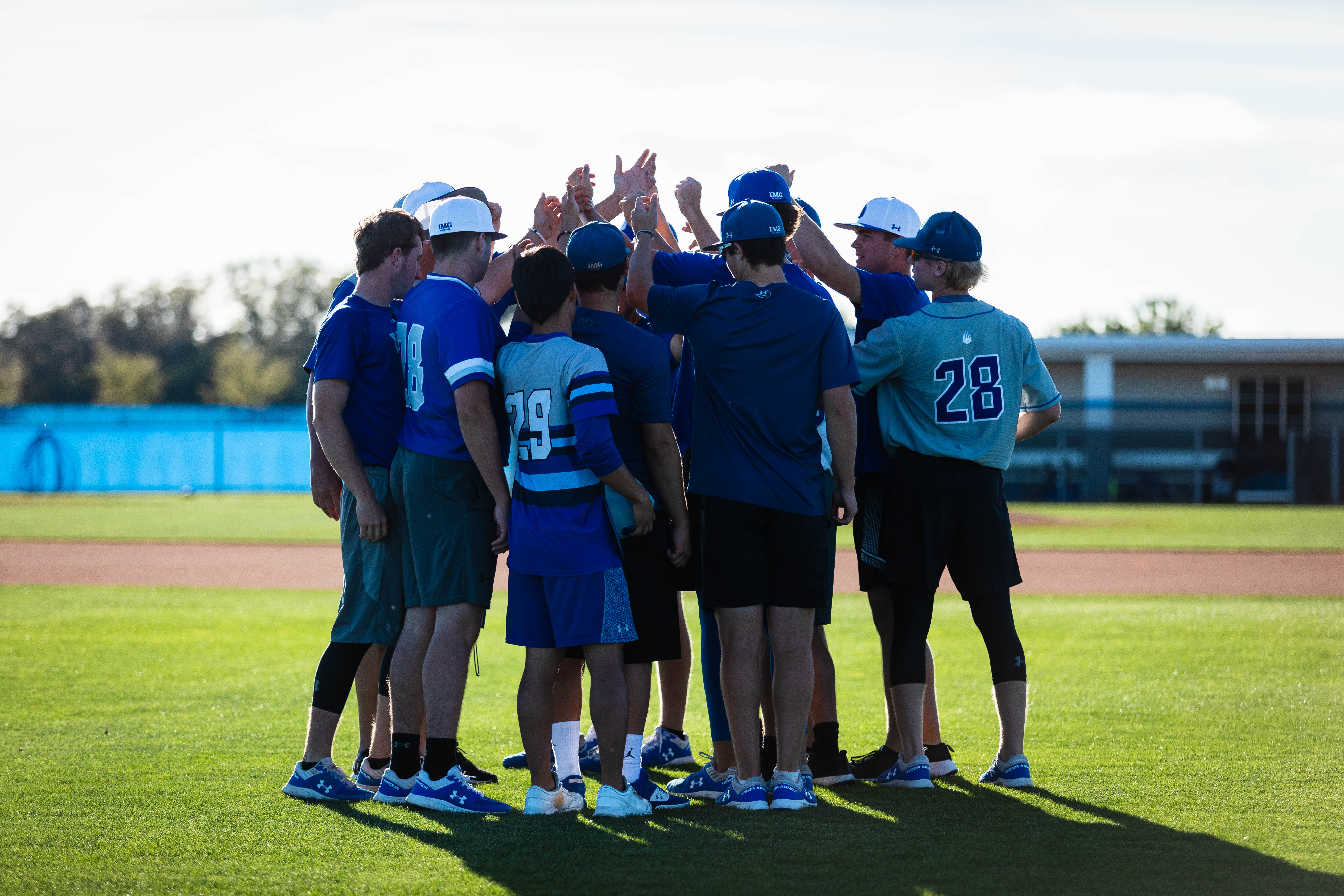 img academy athletes huddle