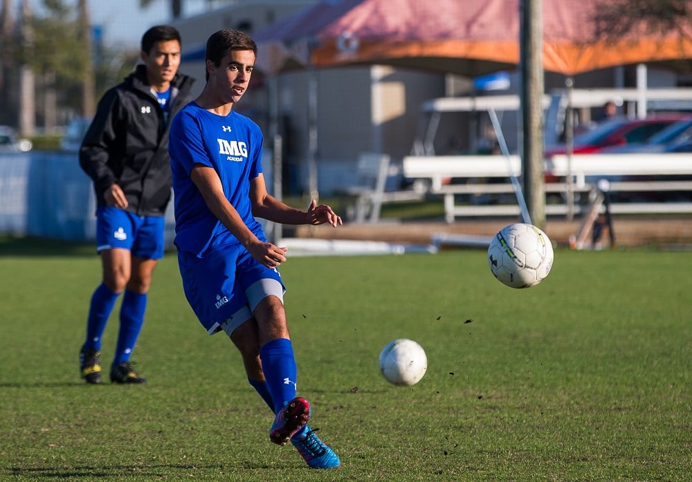 Male High School Soccer Player Kicking Ball | IMGAcademy.com