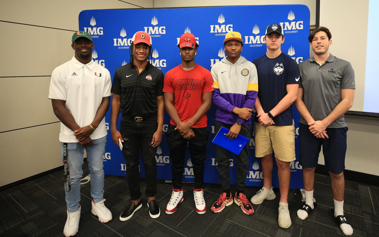 img football players at signing day ceremony | IMGAcademy.com