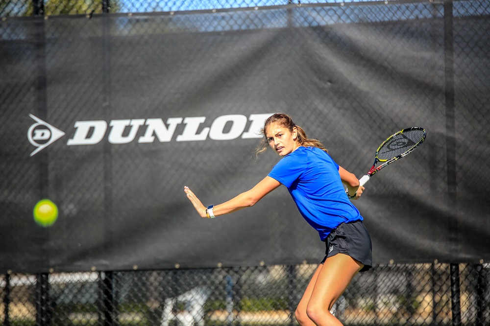 Female IMG Academy Tennis Athlete Prepares to Hit the Ball with a Forehand Swing