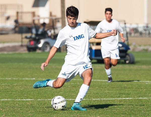 Soccer player kicks soccer ball | IMG Academy