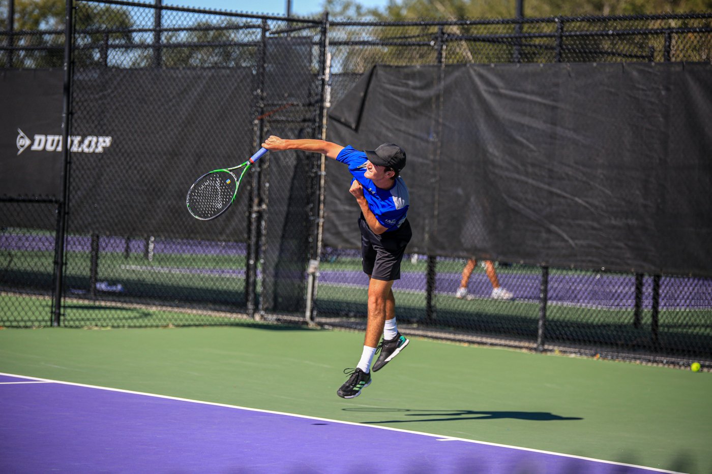 tennis player hits a server at IMG Academy