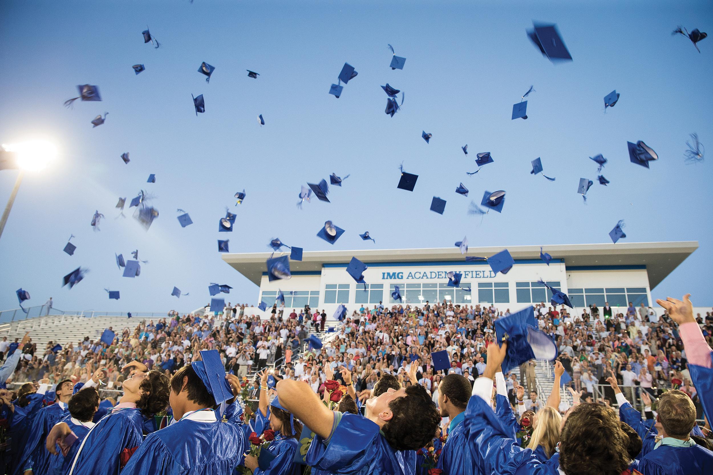 Graduates throw caps in the air | IMG Academy