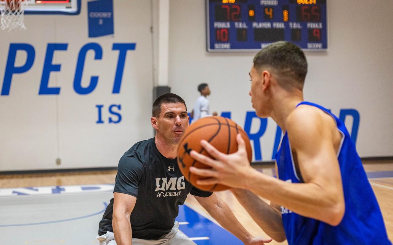 basketball coach and player practicing shooting drills