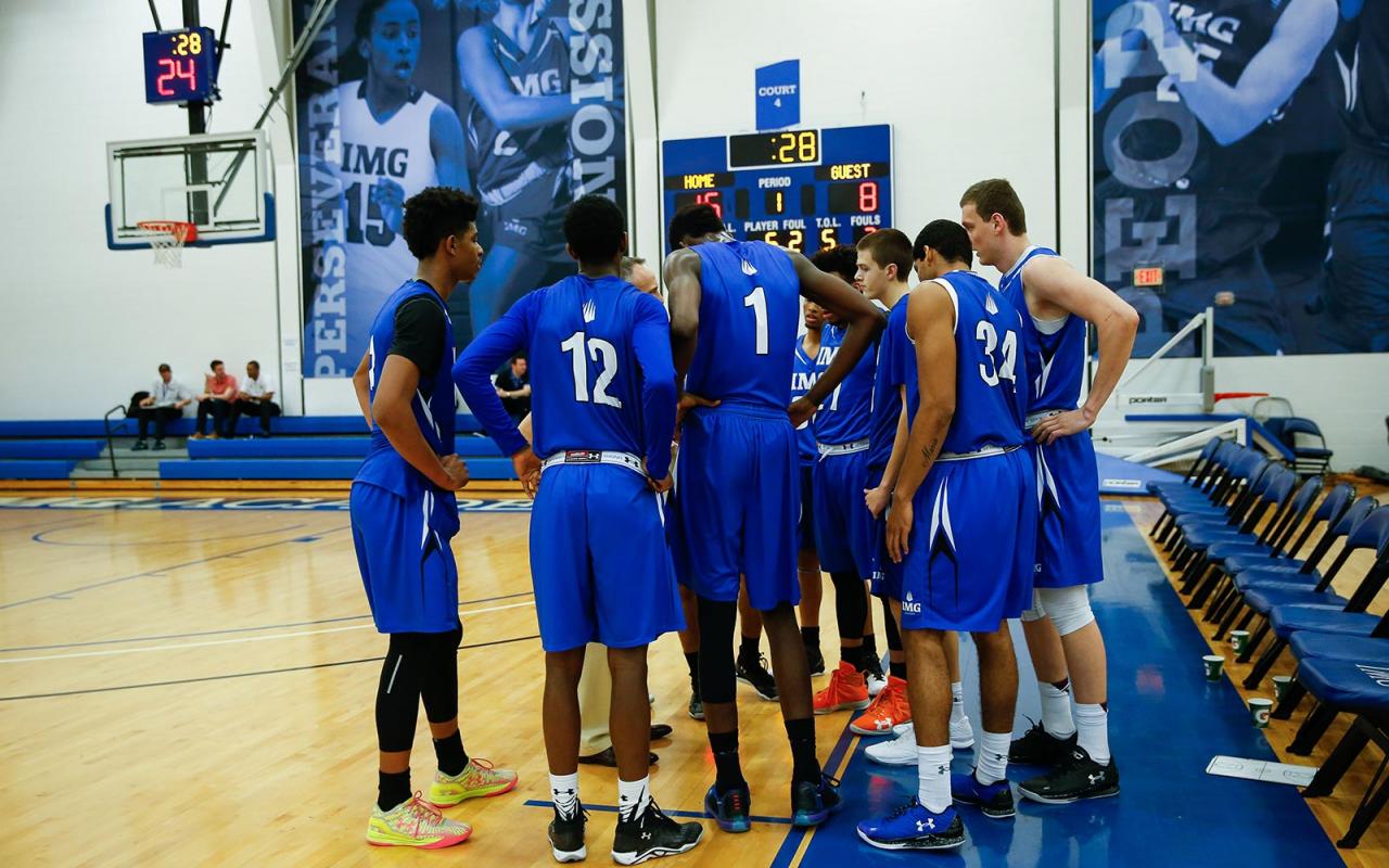 boys basketball players huddling up before practice