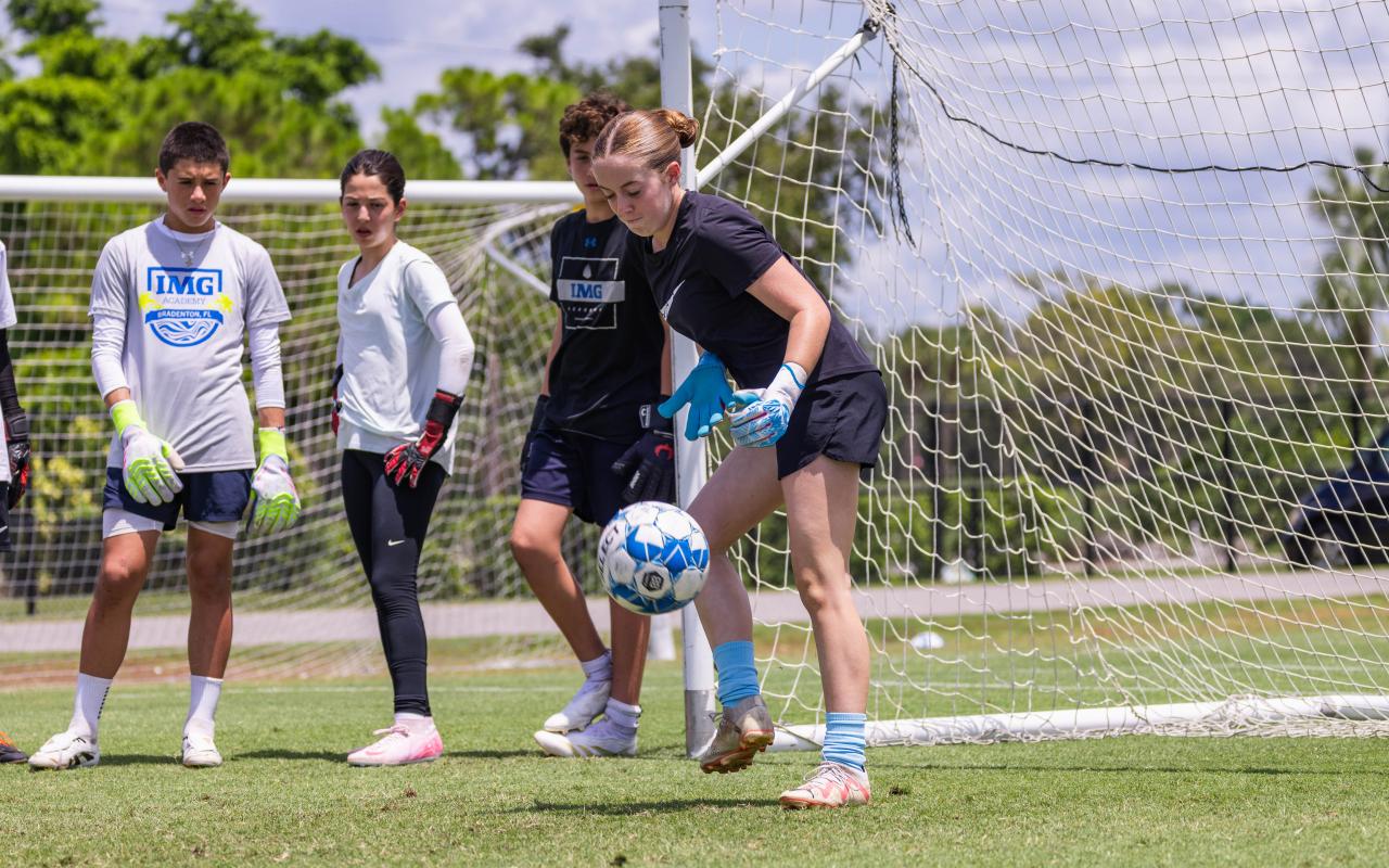 Campers doing a goal keeping training exercise at IMG Academy Soccer Camp