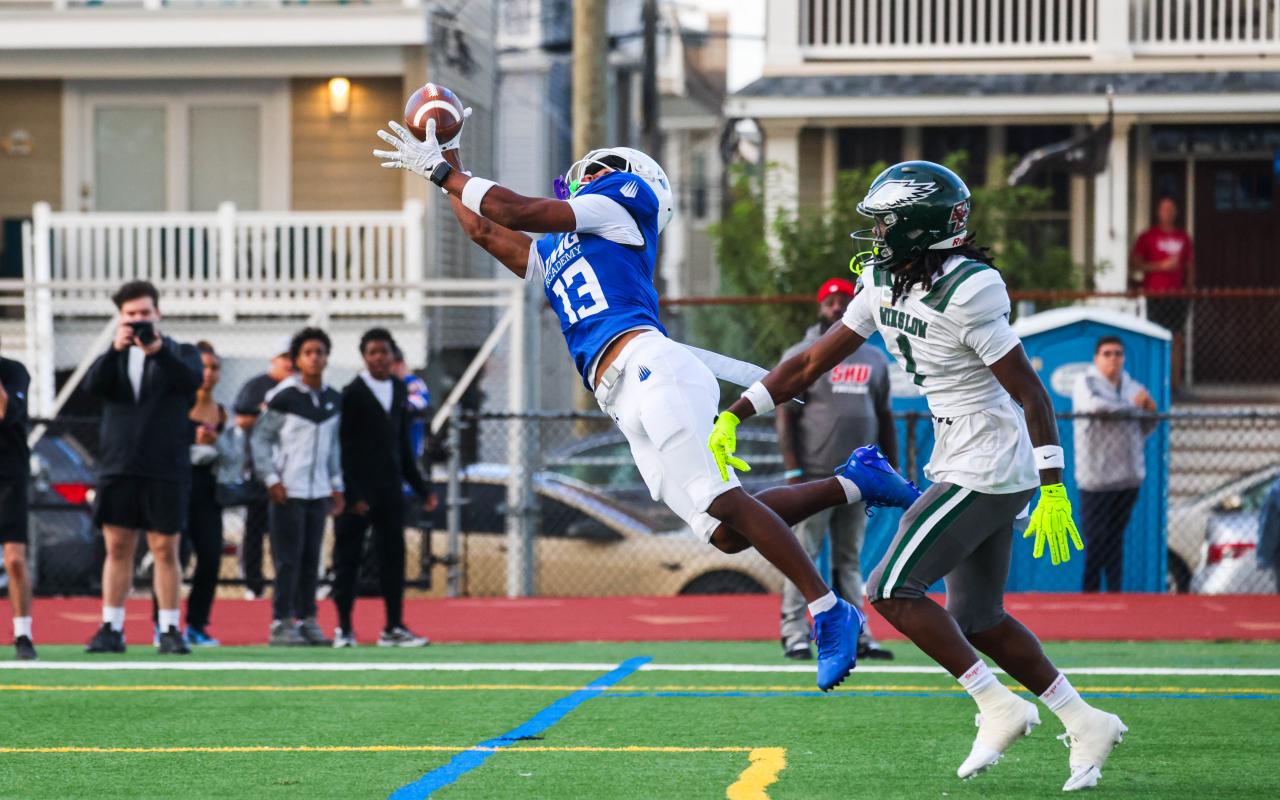 IMG Academy football athlete catching a ball in a game