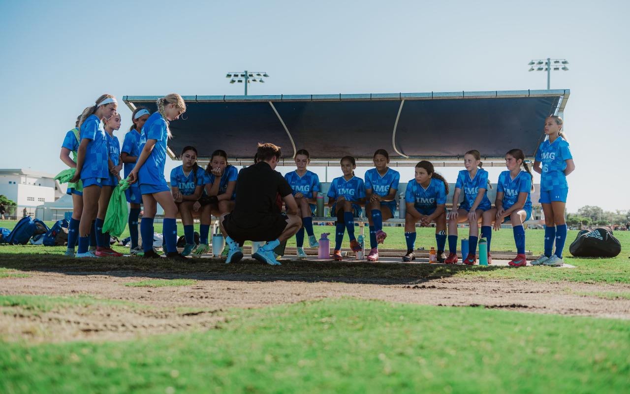 IMG Soccer Camp team huddle