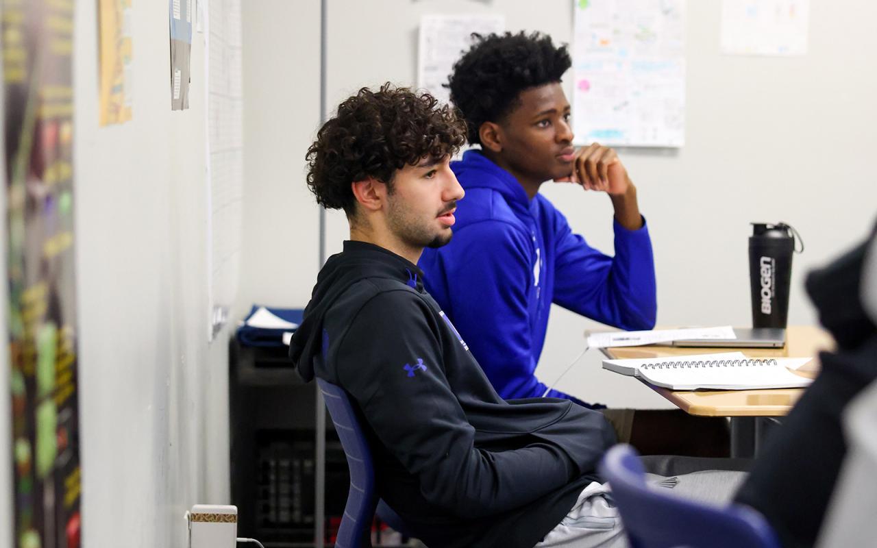 Students watching game film