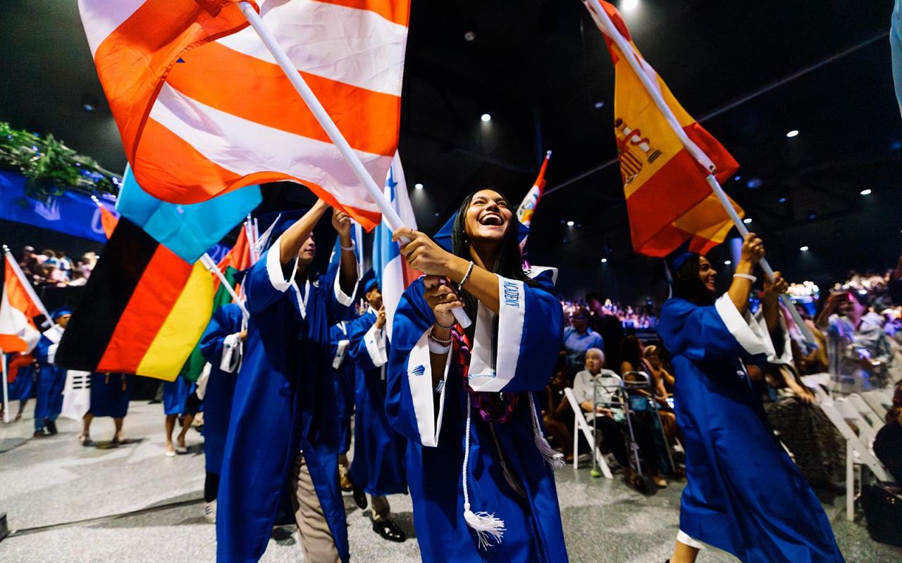 Students walking outside of graduation