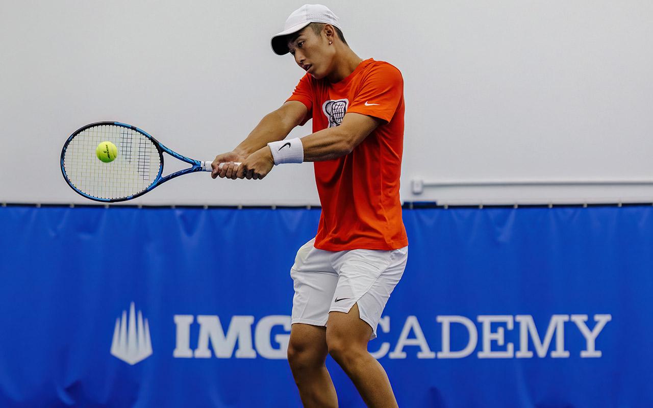 Jerry Shang practices tennis at IMG Academy