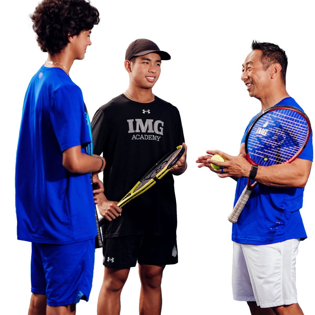 Tennis camper learning from IMG coach